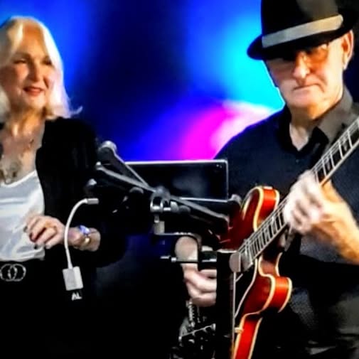 Ann and Allen performing on stage
